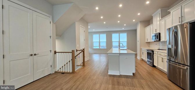 Interior, Kitchen, Recessed Lighting, Stainless Steel Appliances, Water, Wood Texture Flooring