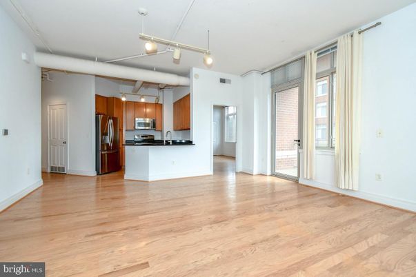 Empty room, Interior, Kitchen, Pendant Lights, Stainless Steel Appliances, Wood Texture Flooring