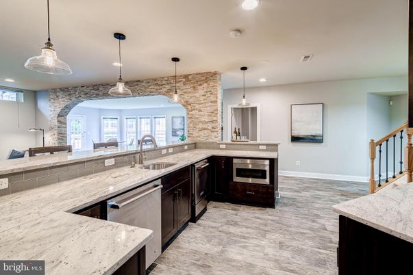 Interior, Kitchen, Pendant Lights, Recessed Lighting, Stainless Steel Appliances, Stone Walls, Wood Texture Flooring