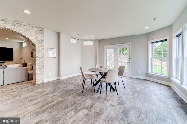 Dining room, Interior, Living room, Recessed Lighting, Stone Walls, Wood Texture Flooring