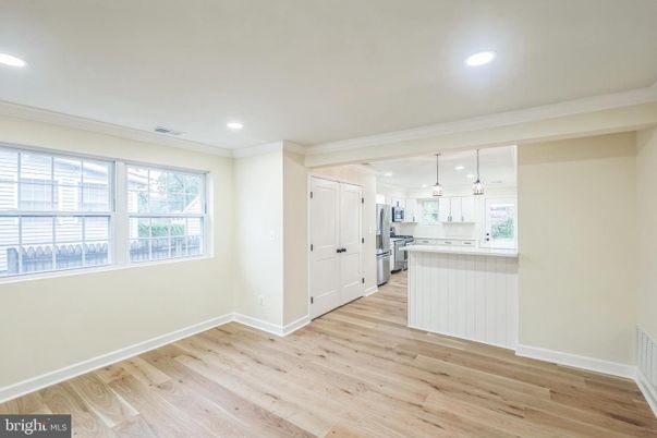 Empty room, Interior, Kitchen, Pendant Lights, Recessed Lighting, Stainless Steel Appliances, Wood Texture Flooring