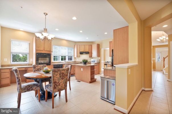 Chandelier, Dining room, Fireplace, Interior, Kitchen, Recessed Lighting, Stainless Steel Appliances
