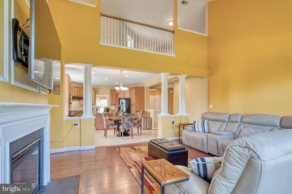 Chandelier, Dining room, Fireplace, Interior, Kitchen, Living room, Recessed Lighting, Wood Texture Flooring