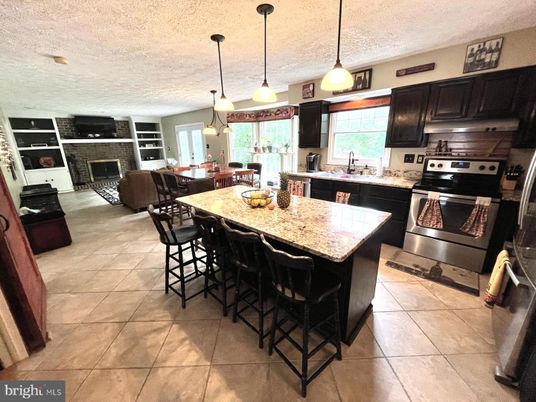 Dining room, Fireplace, Interior, Kitchen, Pendant Lights, Stainless Steel Appliances