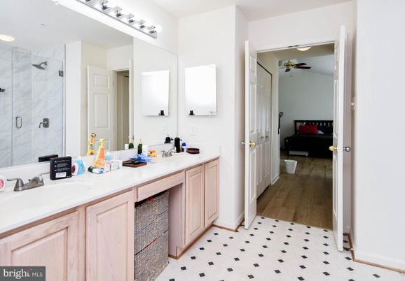 Bathroom, Bedroom, Dual Sink Vanities, Glass Shower, Interior, Marble Walls, Recessed Lighting, Wood Texture Flooring
