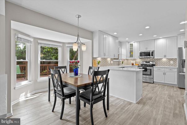 Dining room, Interior, Kitchen, Pendant Lights, Recessed Lighting, Stainless Steel Appliances, Wood Texture Flooring
