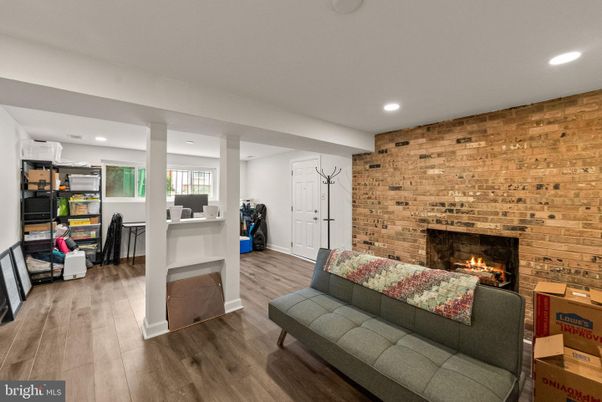Fireplace, Interior, Living room, Recessed Lighting, Stone Walls, Wood Texture Flooring, Wooden Walls
