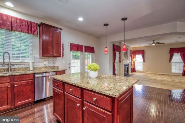 Fireplace, Interior, Kitchen, Pendant Lights, Recessed Lighting, Stainless Steel Appliances, Wood Texture Flooring