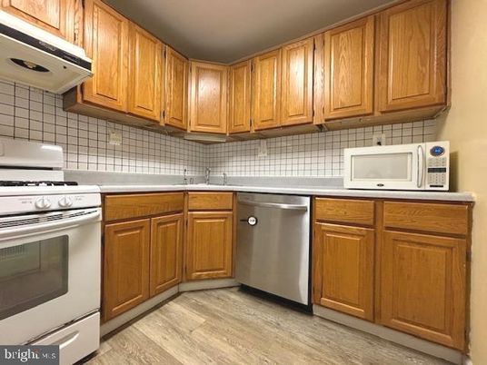 Interior, Kitchen, Stainless Steel Appliances, Tile Countertops, Wood Texture Flooring