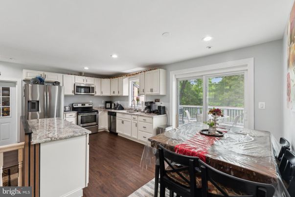 Dining room, Interior, Kitchen, Recessed Lighting, Stainless Steel Appliances, Wood Texture Flooring