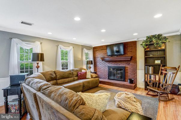Fireplace, Interior, Living room, Recessed Lighting, Stone Walls, Wood Texture Flooring