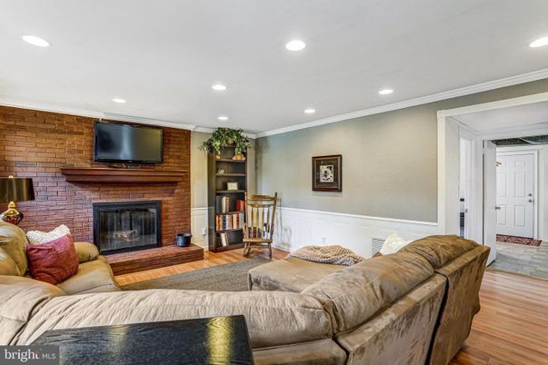 Fireplace, Interior, Living room, Recessed Lighting, Stone Walls, Wood Texture Flooring