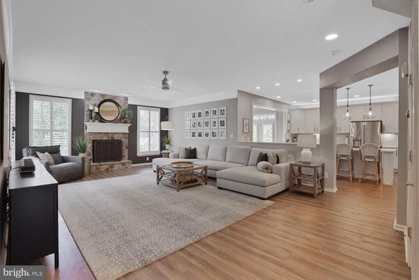 Fireplace, Interior, Kitchen, Living room, Pendant Lights, Recessed Lighting, Stainless Steel Appliances, Wood Texture Flooring