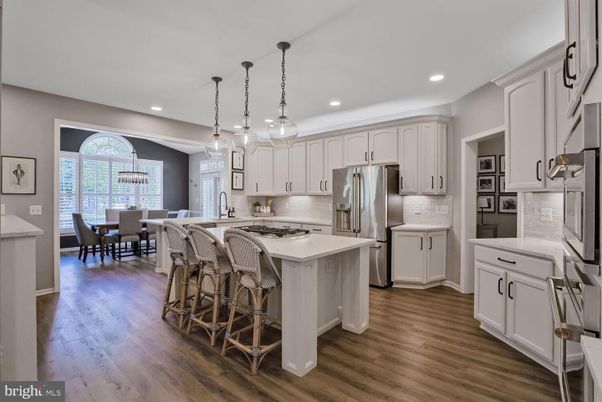 Chandelier, Dining room, Interior, Kitchen, Pendant Lights, Recessed Lighting, Stainless Steel Appliances, Wood Texture Flooring