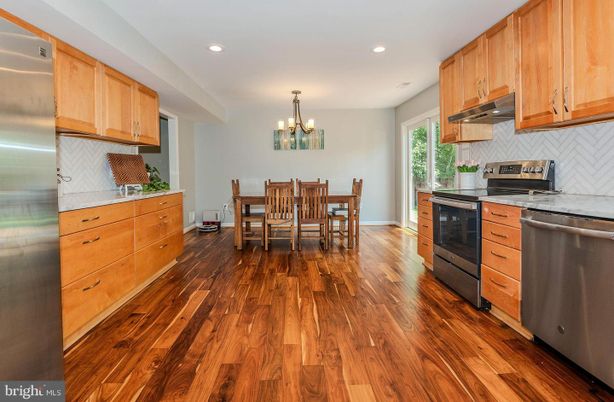 Chandelier, Dining room, Interior, Kitchen, Recessed Lighting, Stainless Steel Appliances, Wood Texture Flooring