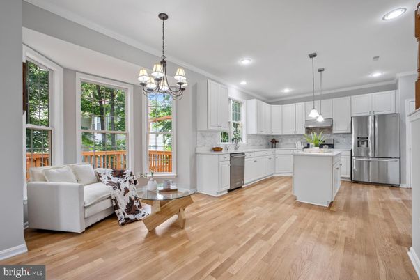 Chandelier, Interior, Kitchen, Living room, Pendant Lights, Recessed Lighting, Stainless Steel Appliances, Wood Texture Flooring