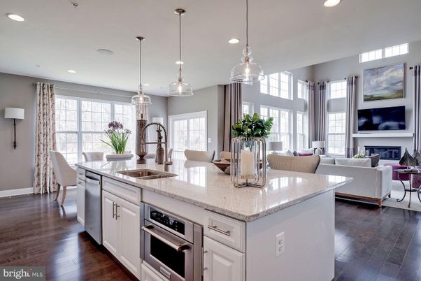 Dining room, Fireplace, Interior, Kitchen, Living room, Pendant Lights, Recessed Lighting, Stainless Steel Appliances, Wood Texture Flooring