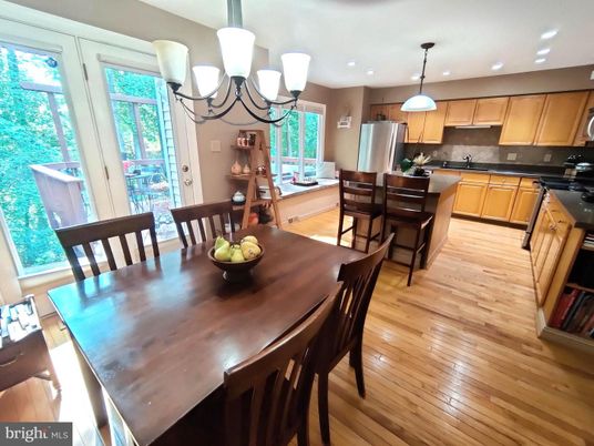 Chandelier, Dining room, Interior, Kitchen, Pendant Lights, Recessed Lighting, Stainless Steel Appliances, Wood Texture Flooring