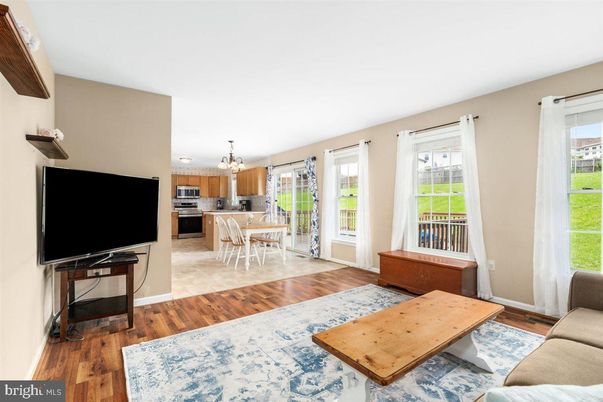 Chandelier, Dining room, Interior, Kitchen, Living room, Stainless Steel Appliances, Wood Texture Flooring