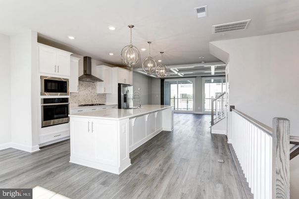 Chandelier, Interior, Kitchen, Pendant Lights, Recessed Lighting, Stainless Steel Appliances, Wood Texture Flooring