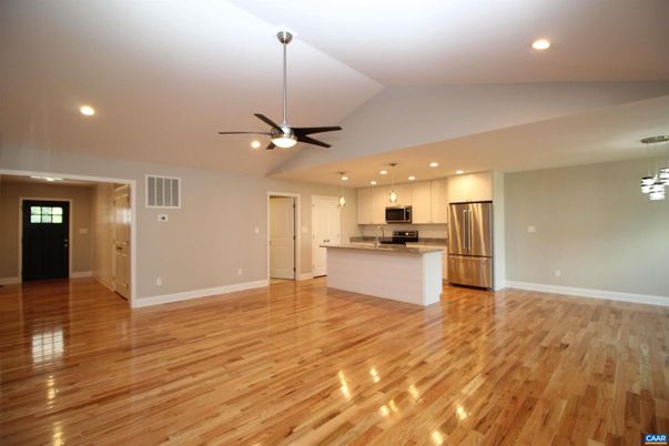 Empty room, Interior, Kitchen, Pendant Lights, Recessed Lighting, Stainless Steel Appliances, Wood Texture Flooring