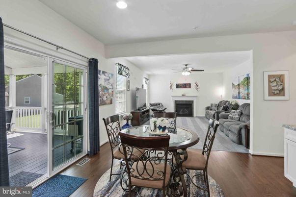 Dining room, Fireplace, Interior, Living room, Recessed Lighting, Wood Texture Flooring