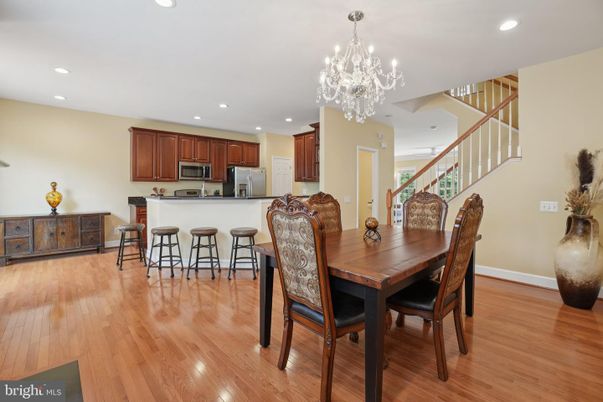 Chandelier, Dining room, Interior, Kitchen, Recessed Lighting, Stainless Steel Appliances, Wood Texture Flooring