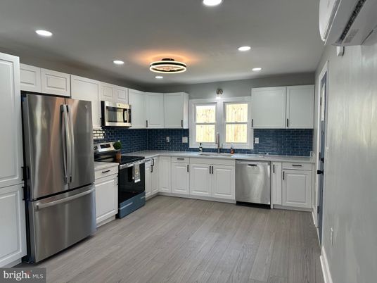 Interior, Kitchen, Recessed Lighting, Stainless Steel Appliances, Wood Texture Flooring