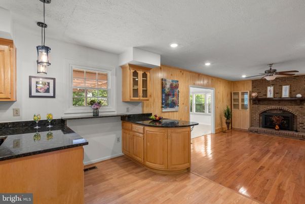 Fireplace, Interior, Kitchen, Pendant Lights, Recessed Lighting, Stone Walls, Wood Texture Flooring, Wooden Walls
