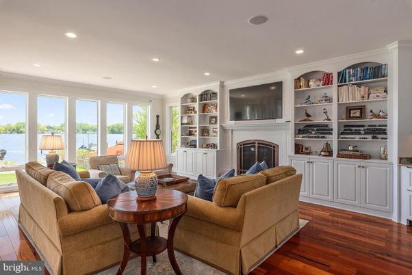 Fireplace, Interior, Living room, Recessed Lighting, Water, Wood Texture Flooring