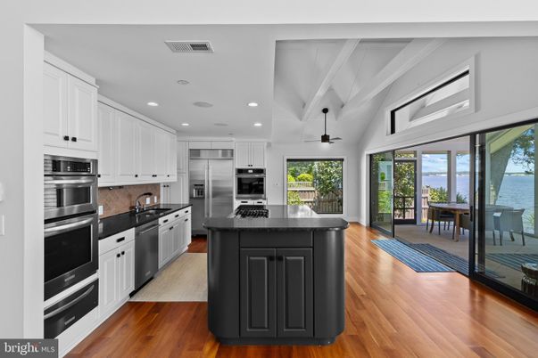 Dining room, Interior, Kitchen, Recessed Lighting, Stainless Steel Appliances, Water, Wood Texture Flooring
