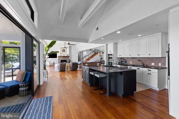 Fireplace, Interior, Kitchen, Living room, Pendant Lights, Recessed Lighting, Stainless Steel Appliances, Wood Texture Flooring