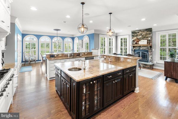 Dining room, Fireplace, Interior, Kitchen, Pendant Lights, Recessed Lighting, Wood Texture Flooring