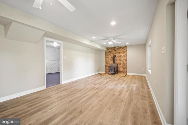 Empty room, Fireplace, Interior, Recessed Lighting, Stone Walls, Wood Texture Flooring
