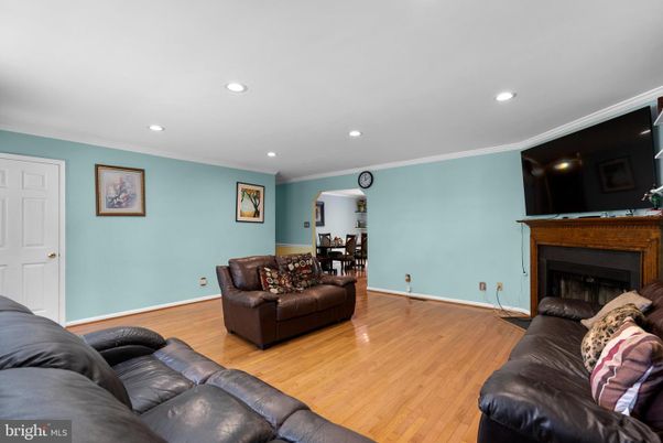 Dining room, Fireplace, Interior, Living room, Recessed Lighting, Wood Texture Flooring