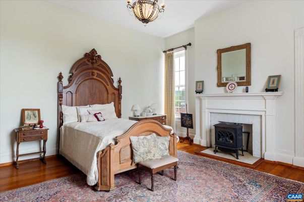 Bedroom, Chandelier, Fireplace, Interior, Wood Texture Flooring