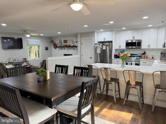 Dining room, Interior, Kitchen, Recessed Lighting, Stainless Steel Appliances, Wood Texture Flooring
