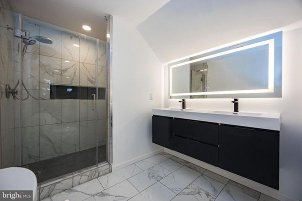 Bathroom, Dual Sink Vanities, Glass Shower, Interior, Marble, Marble Walls, Recessed Lighting