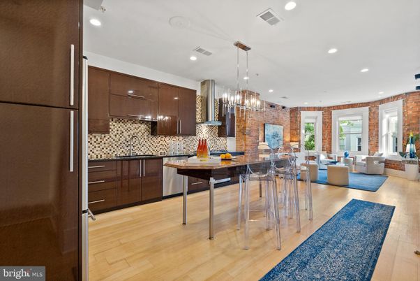 Dining room, Interior, Kitchen, Living room, Pendant Lights, Recessed Lighting, Stainless Steel Appliances, Stone Walls, Wood Texture Flooring