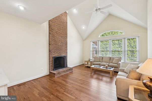 Fireplace, Interior, Living room, Recessed Lighting, Stone Walls, Wood Texture Flooring