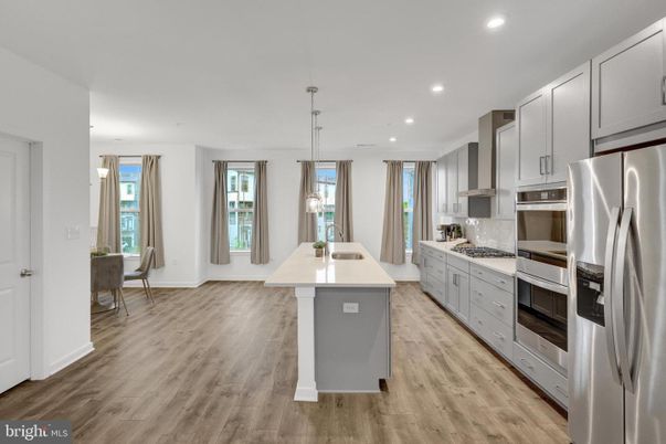 Dining room, Interior, Kitchen, Pendant Lights, Recessed Lighting, Stainless Steel Appliances, Wood Texture Flooring