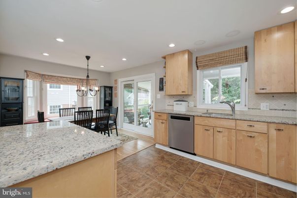 Chandelier, Dining room, Interior, Kitchen, Recessed Lighting, Stainless Steel Appliances, Wood Texture Flooring
