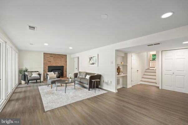 Fireplace, Interior, Living room, Recessed Lighting, Stone Walls, Wood Texture Flooring