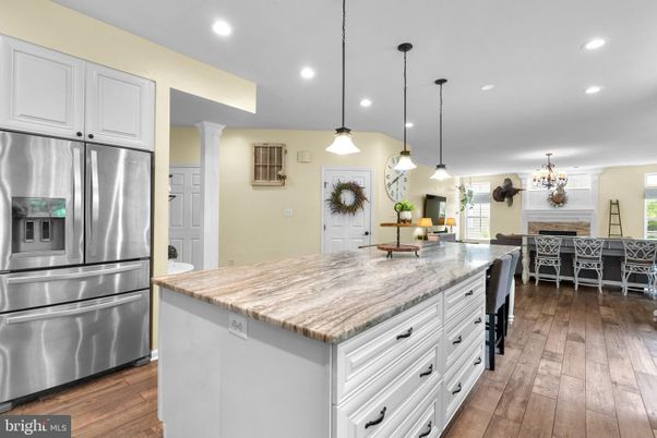 Chandelier, Dining room, Interior, Kitchen, Pendant Lights, Recessed Lighting, Stainless Steel Appliances, Wood Texture Flooring