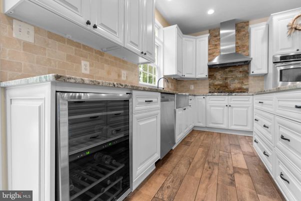 Interior, Kitchen, Recessed Lighting, Stainless Steel Appliances, Stone Walls, Wood Texture Flooring