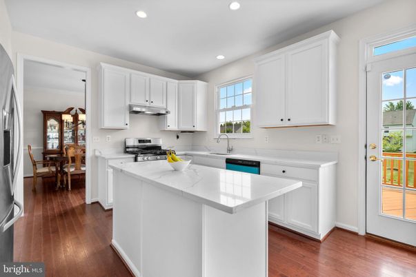 Dining room, Interior, Kitchen, Recessed Lighting, Stainless Steel Appliances, Wood Texture Flooring