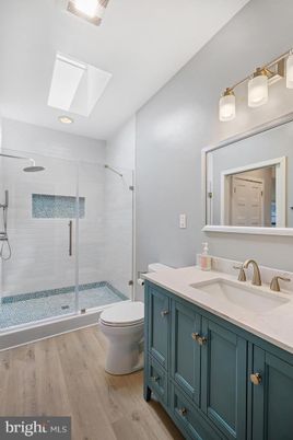 Bathroom, Glass Shower, Interior, Recessed Lighting, Wood Texture Flooring