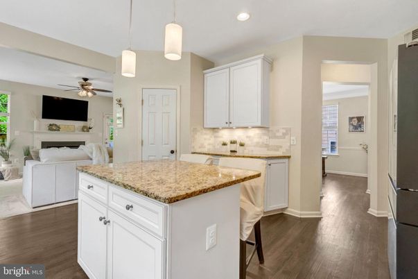 Fireplace, Interior, Kitchen, Pendant Lights, Recessed Lighting, Washer, Wood Texture Flooring