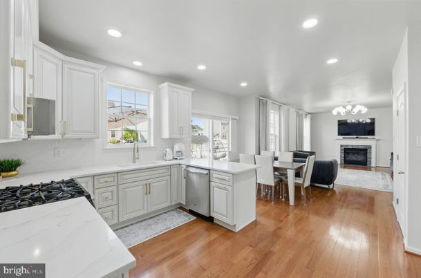 Dining room, Fireplace, Interior, Kitchen, Recessed Lighting, Wood Texture Flooring