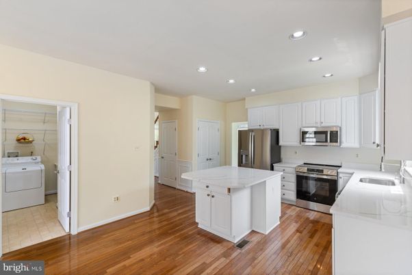 Interior, Kitchen, Recessed Lighting, Stainless Steel Appliances, Washer, Wood Texture Flooring